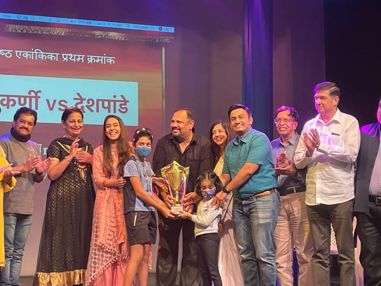 The club's team receiving first prize for “Kulkarni vi. Deshpande” at the Ekankika competition