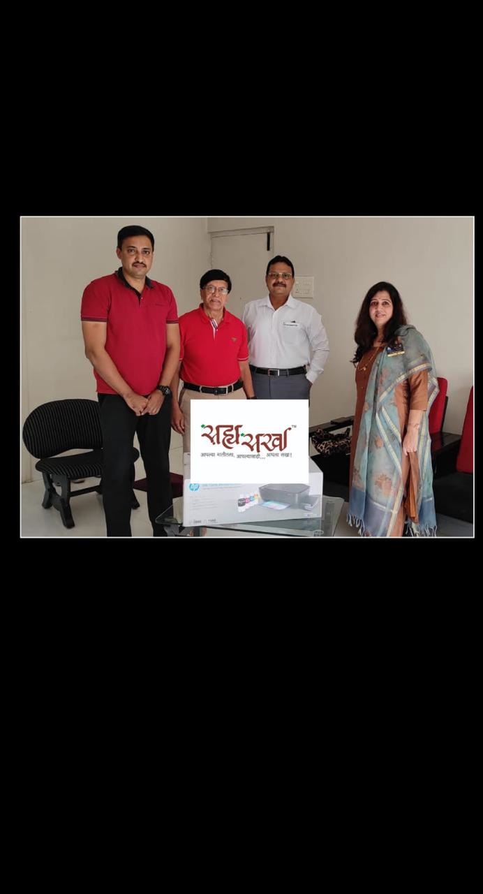 Club members handing over a printer to the Sahyasakha Foundation, which works with Adivasi communities near Junnar